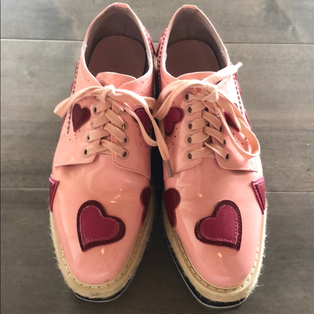 Prada pink patent platform brogues.